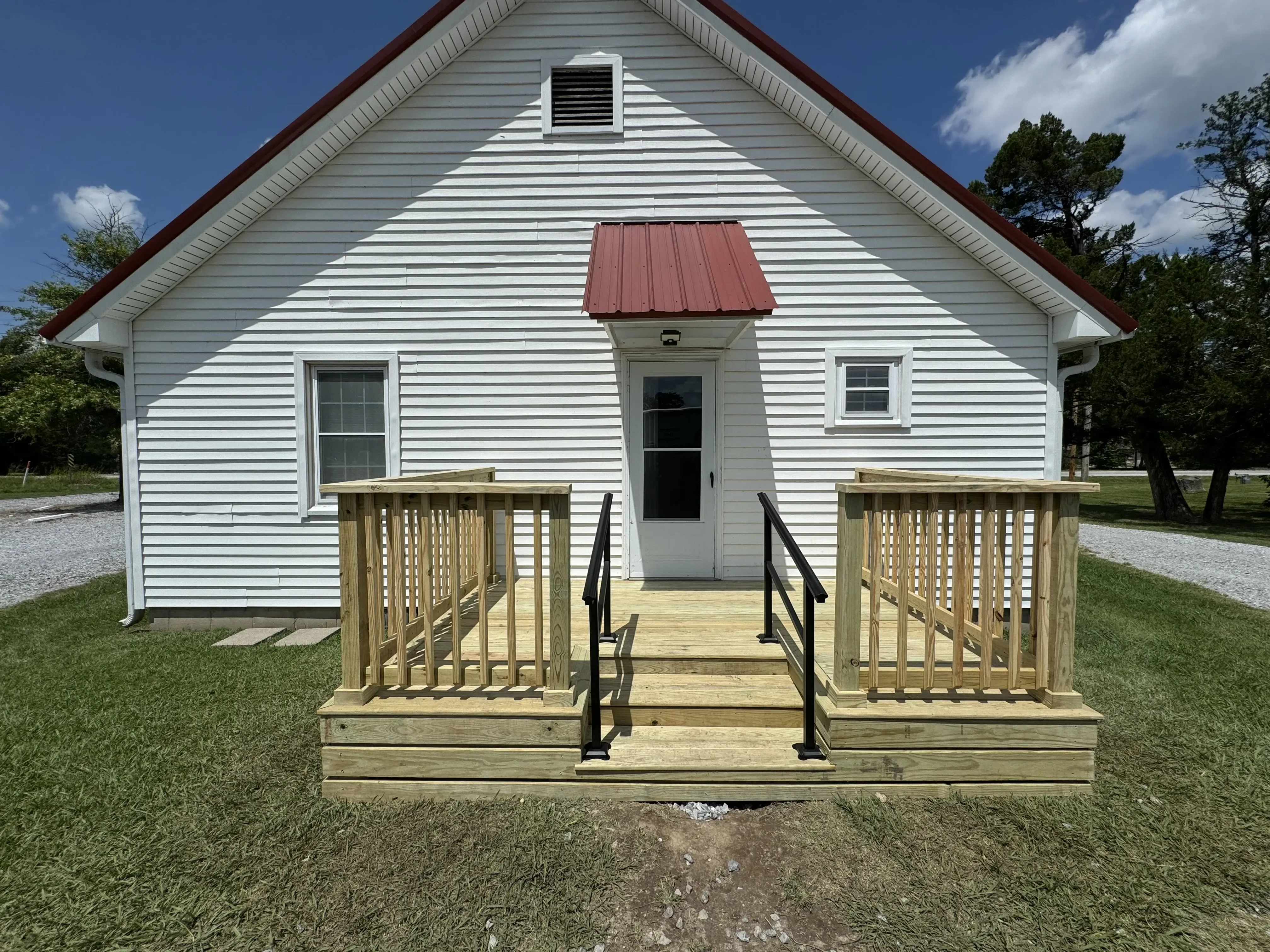 Southern yellow pine pressure-treated deck with black handrails — JHG Contracting LLC serving Mountainburg, AR